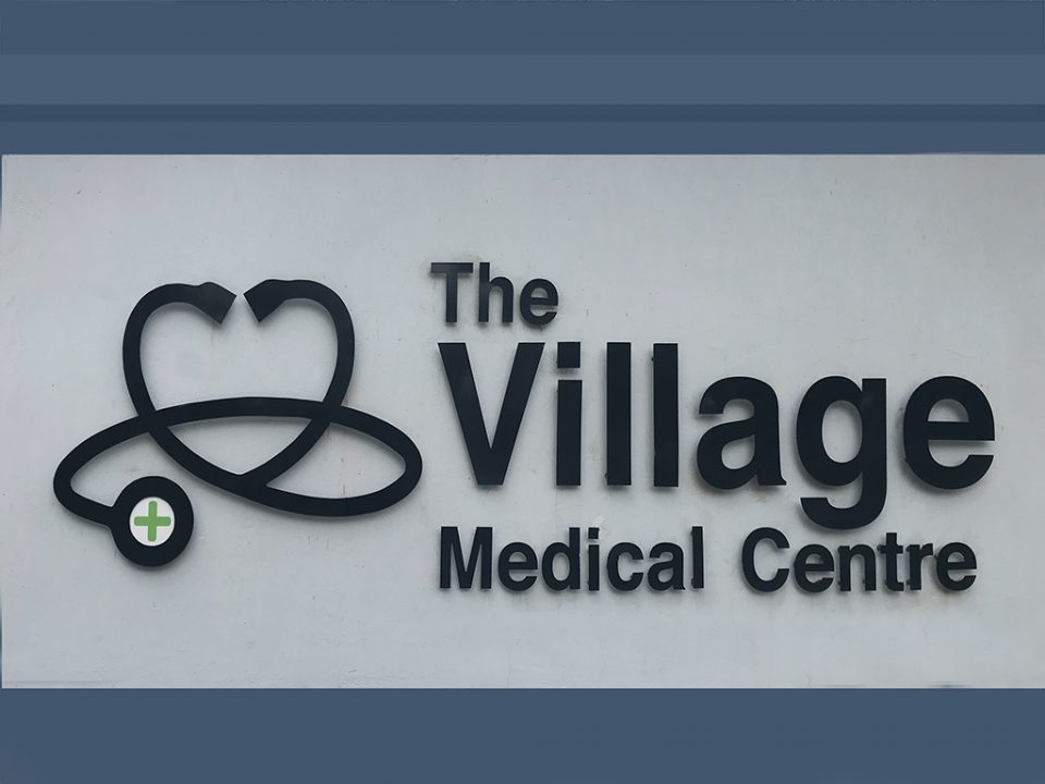 Village Med Sign